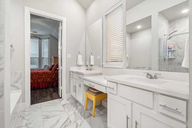 Primary ensuite with sit down area for makeup and hair prep | Image 18