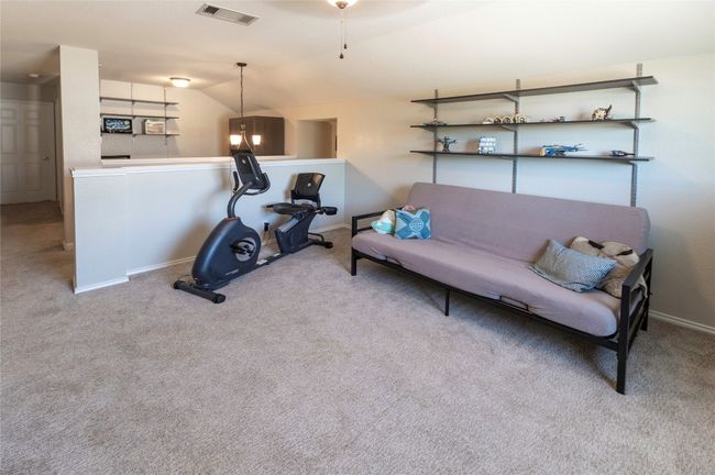 The loft could have been a 5th bedroom by continuing the half wall up and adding a door. | Image 25