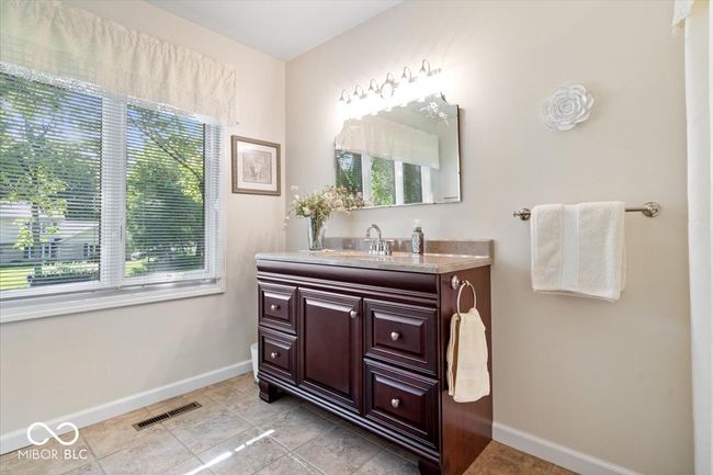 bathroom featuring baseboards and vanity | Image 29
