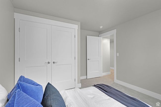Bedroom featuring light carpet and a closet | Image 14