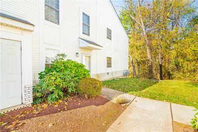 View of property exterior with a lawn | Image 2