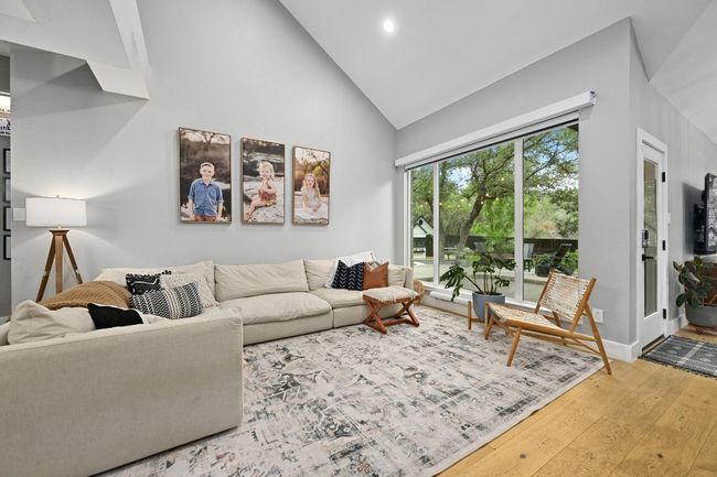 Tall ceilings and big windows in the living space. | Image 4