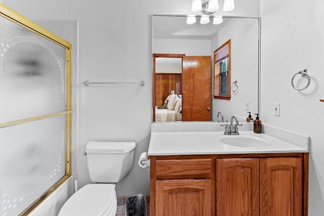 Full bath featuring vanity and enclosed tub / shower combo | Image 27