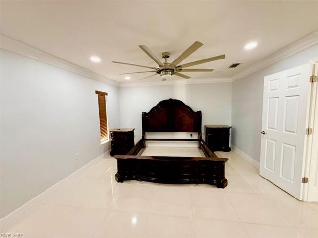 Tiled bedroom featuring visible vents, baseboards, recessed lighting, ornamental molding, and a ceiling fan | Image 17