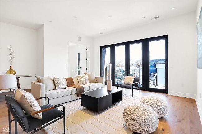 Spacious living area with 8ft window/door system which opens to your own private outdoor space and allows for natural light and great views | Image 16