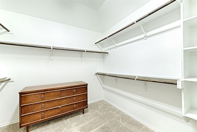 Walk in closet featuring carpet flooring | Image 16