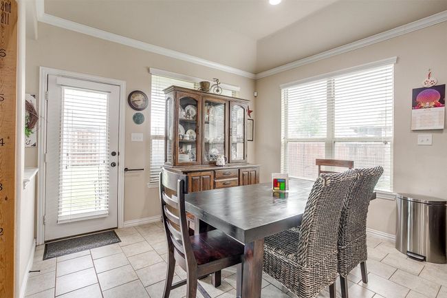 Dining area with access to backyard. | Image 9