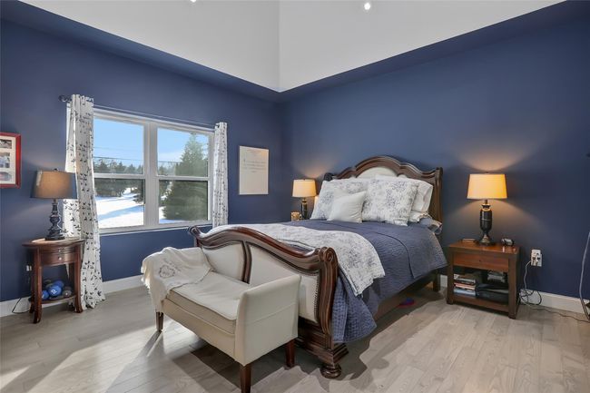 Bedroom featuring light hardwood / wood-style floors | Image 12