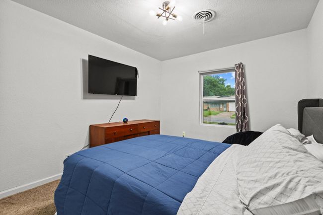 Bedroom with carpet floors and baseboards | Image 28