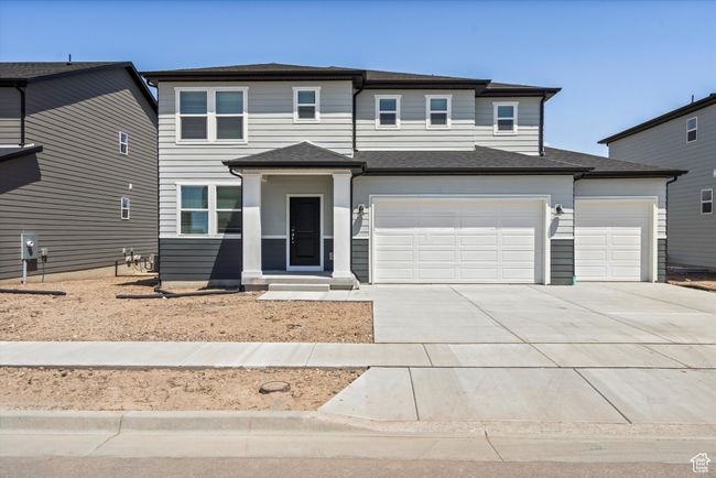 View of front of property with concrete driveway and a garage | Image 5