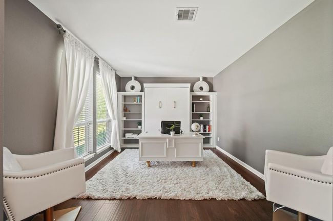 Designed with both function and aesthetics in mind, this private office includes built-in shelving and plenty of space for your dream desk setup—perfect for remote work or quiet study. | Image 10