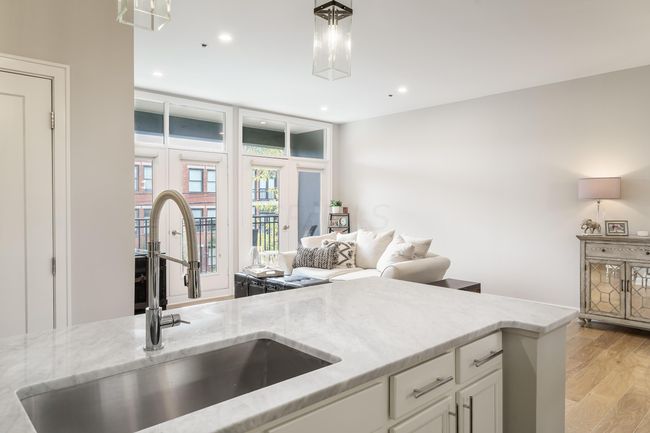 high end kitchen looking into the living room | Image 8
