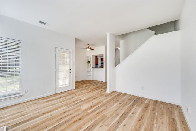 Living room, looking towards dining area and kitchen. Freshly painted throughout, including ceiling! Move-in ready. | Image 6