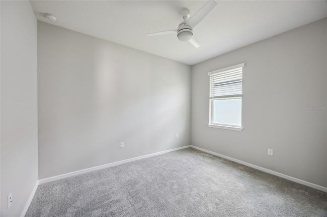 Bedroom 3, custom built in closet, ceiling fan | Image 24