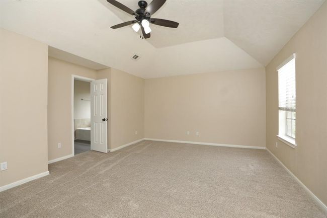 High ceilings in primary bedroom. | Image 23