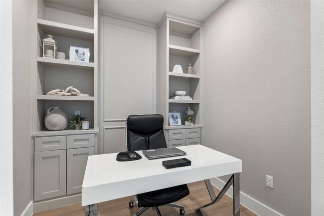 Office with wood finished floors, built in features, and a textured wall | Image 11