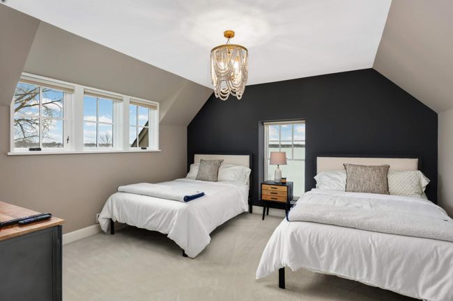 Guest bedroom 2 is in the upper level, also lake facing | Image 34