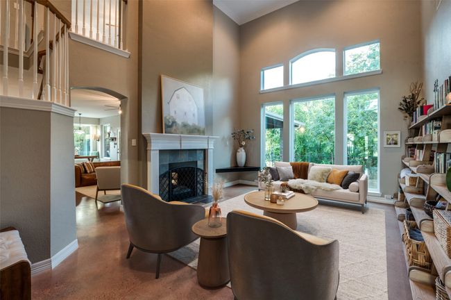 Virtually staged, this formal living rm has FP with gas logs, huge windows overlooking the beautiful outdoors | Image 15