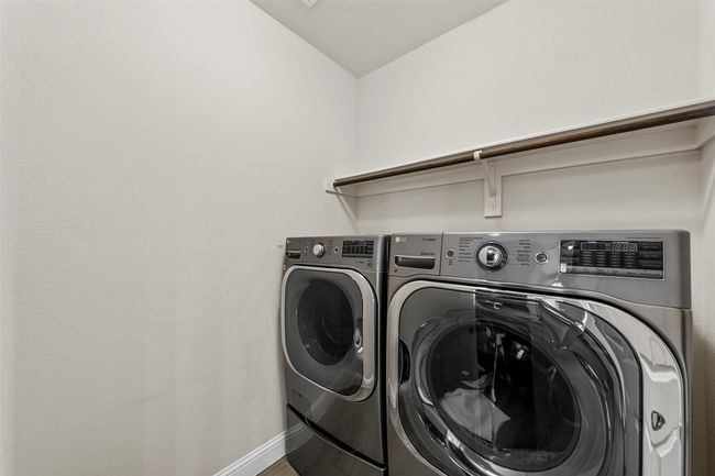 Laundry room with washing machine and dryer and baseboards | Image 19