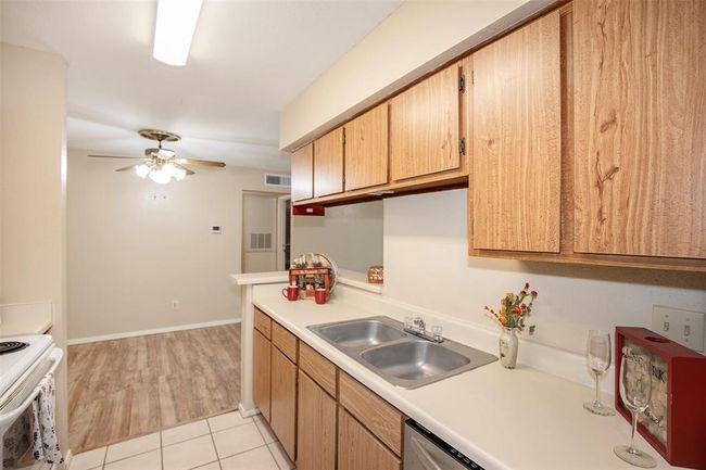 The kitchen has ample cabinet space. | Image 20