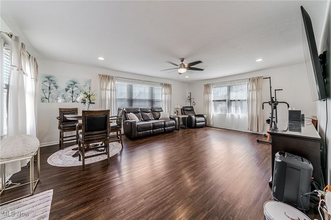 Living area featuring dark wood-style floors, baseboards, recessed lighting, and a ceiling​​‌​​​​‌​​‌‌​‌‌​​​‌‌​​‌‌​‌​​​​​‌ fan | Image 17