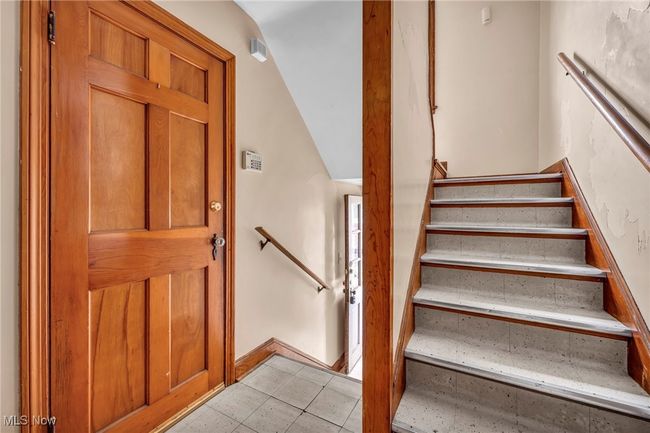 Staircase featuring tile patterned floors | Image 24