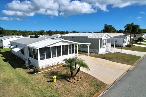 818 Tamarind Cir, Barefoot Bay, FL, 32976-2411 | Card Image