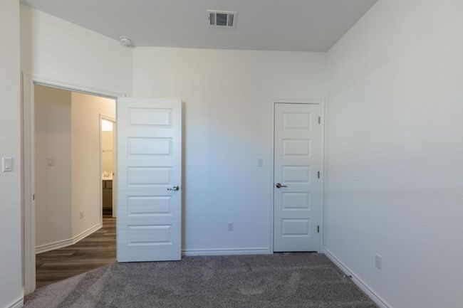Unfurnished bedroom featuring baseboards, visible vents, and carpet | Image 30