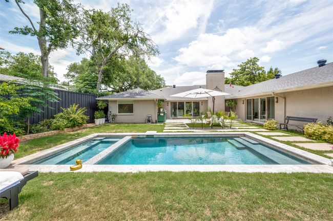 View of pool featuring a pool with connected hot tub | Image 30