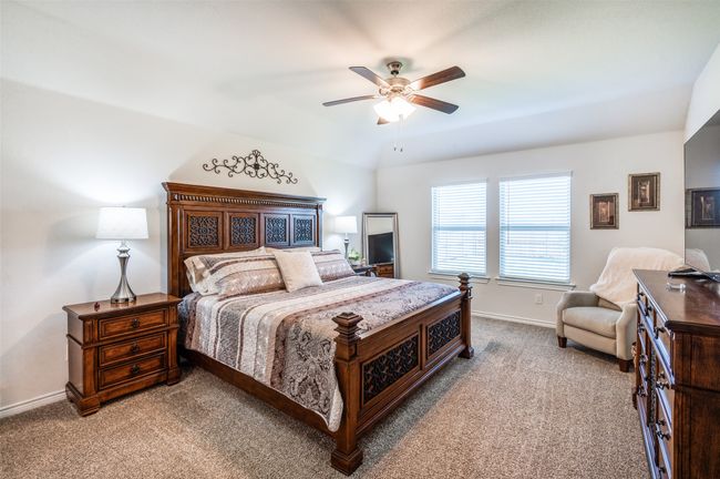 Carpeted bedroom featuring baseboards and ceiling fan | Image 20