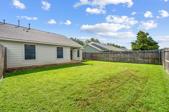 View of fenced backyard | Image 33