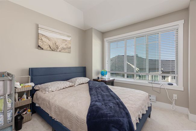 Carpeted bedroom with baseboards | Image 24