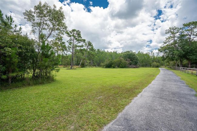 11933 Pasco Trails Blvd, House other with 4 bedrooms, 3 bathrooms and null parking in SPRING HILL FL | Image 37