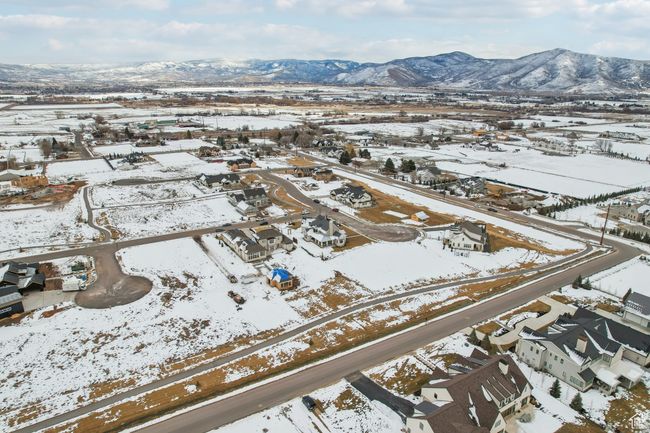 Snowy aerial view featuring a residential view and a mountain view | Image 64
