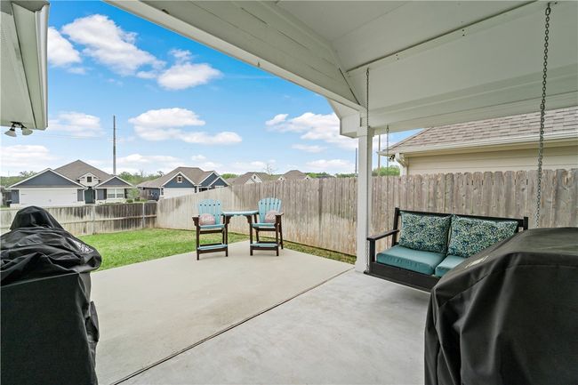 View of patio featuring a fenced backyard and area for grilling | Image 25