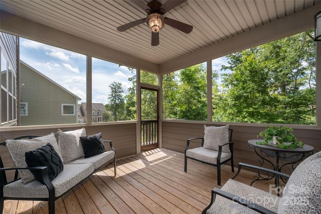 Screened in deck over looking the beautiful rear yard. | Image 36