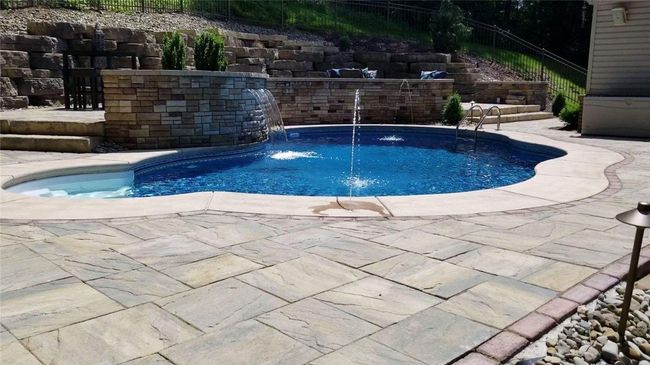 Heated Pool with Stone Waterfall and Water Shooters. | Image 27