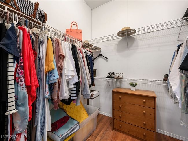 Walk in closet with wood finished floors | Image 31