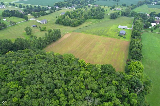 aerial view of sparsely populated area featuring abundant farmland | Image 12