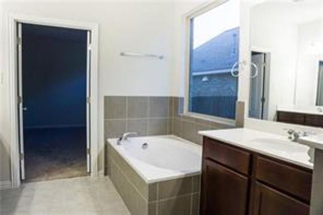 Full bathroom featuring vanity and a garden tub | Image 22