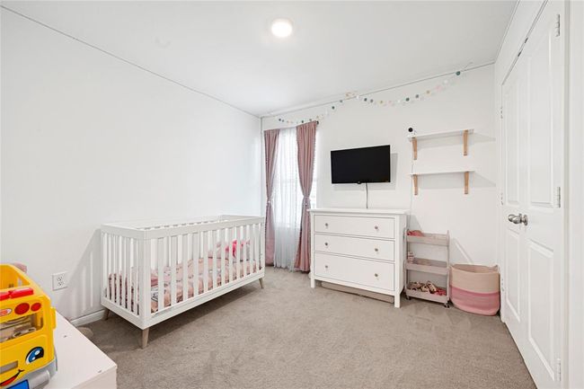 Versatile third bedroom ideal for guests, kids, or hobbies. | Image 26