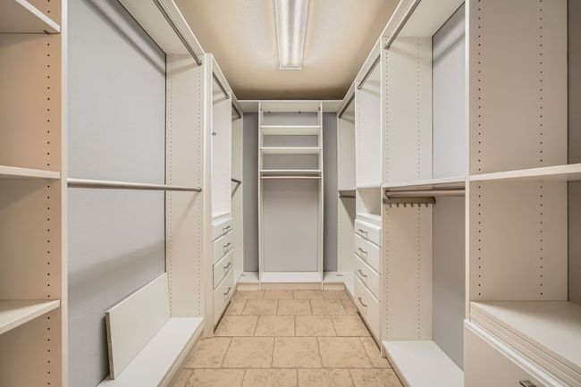 Primary walk in closet with great built-ins | Image 13