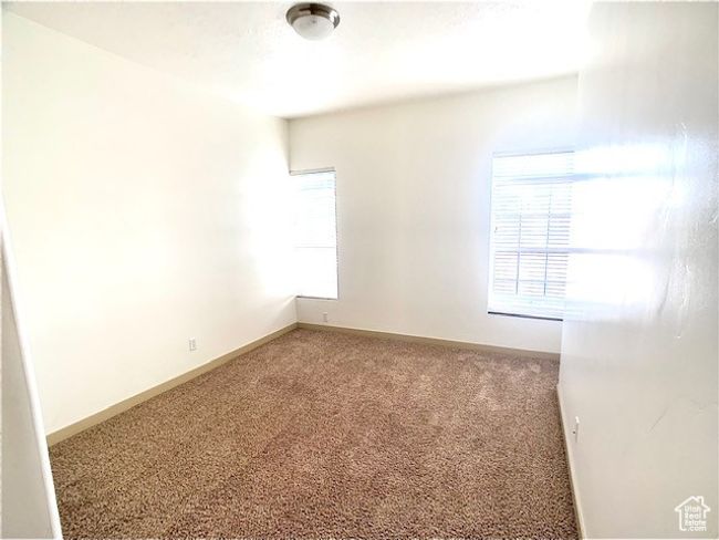 Carpeted spare room with baseboards | Image 7