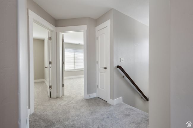 Corridor with an upstairs landing and carpet flooring | Image 18