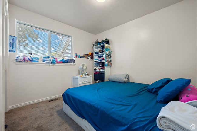 Carpeted bedroom featuring baseboards | Image 30