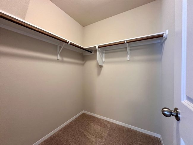 Spacious closet with carpet | Image 24