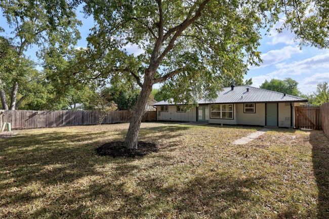 View of fenced backyard | Image 34