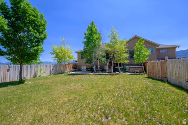 Fully fenced private back yard with spa | Image 32