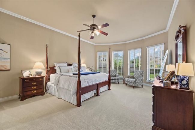 Primary Bedroom with sitting nook near bay windows where you can curl up with a good book and drink morning coffee. | Image 16