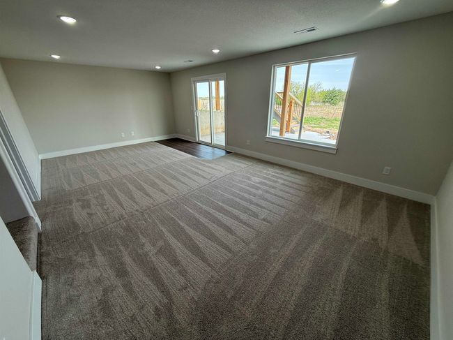 Carpeted spare room featuring recessed lighting and baseboards | Image 12